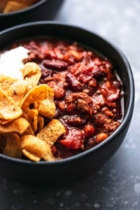 Best ever easy INSTANT POT BEEF CHILI with ground beef, fire roasted tomatoes, and tons of flavor! | lecremedelacrumb.com