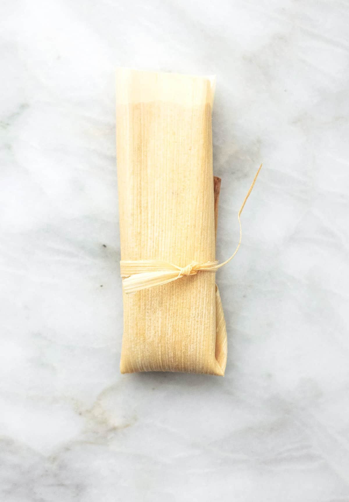 top view of a wrapped tamale.