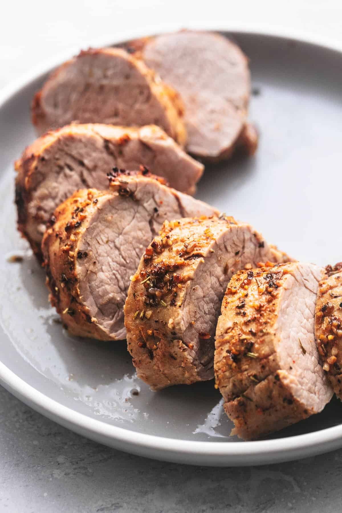 pork tenderloin sliced on a plate.