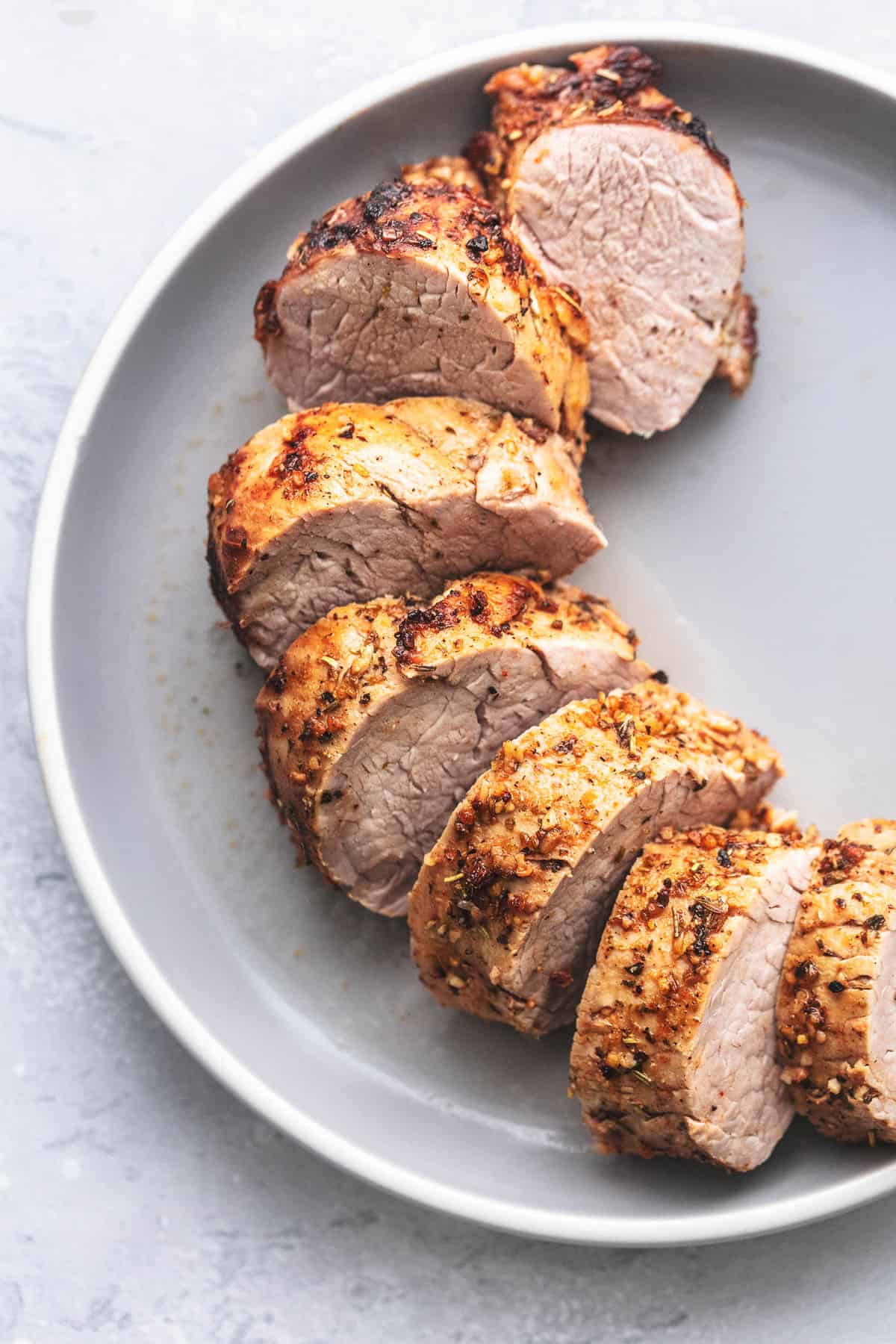 pork tenderloin sliced on a plate.