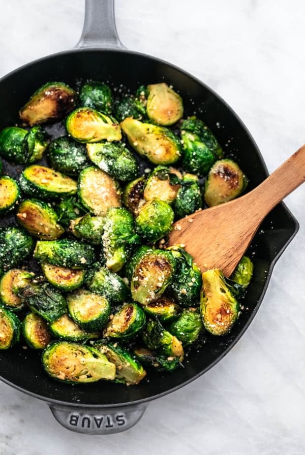 Sauteed Brussels Sprouts Recipe easy side dish with parmesan and garlic | lecremedelacrumb.com