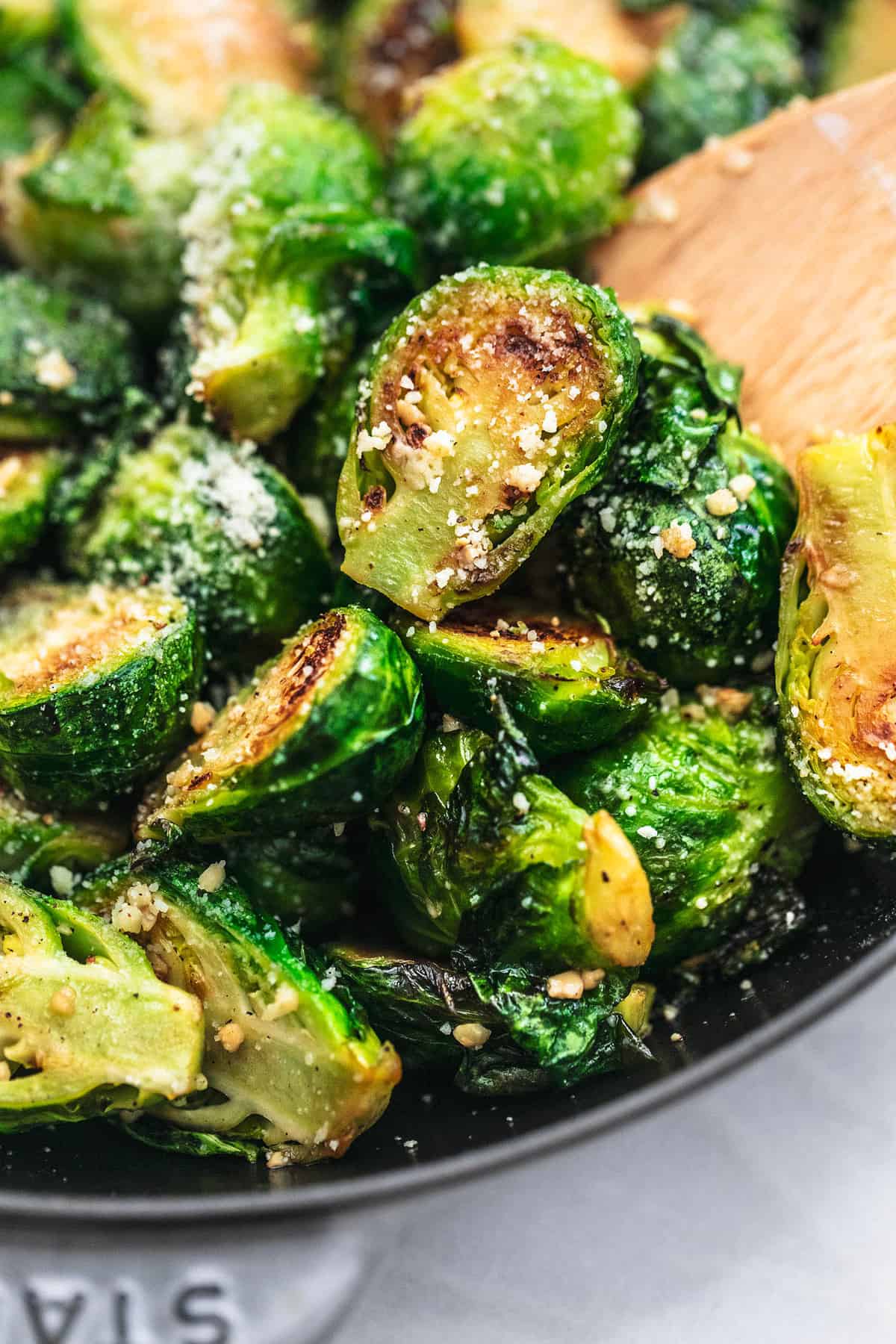 close up of sautéed brussels sprouts in a pan.