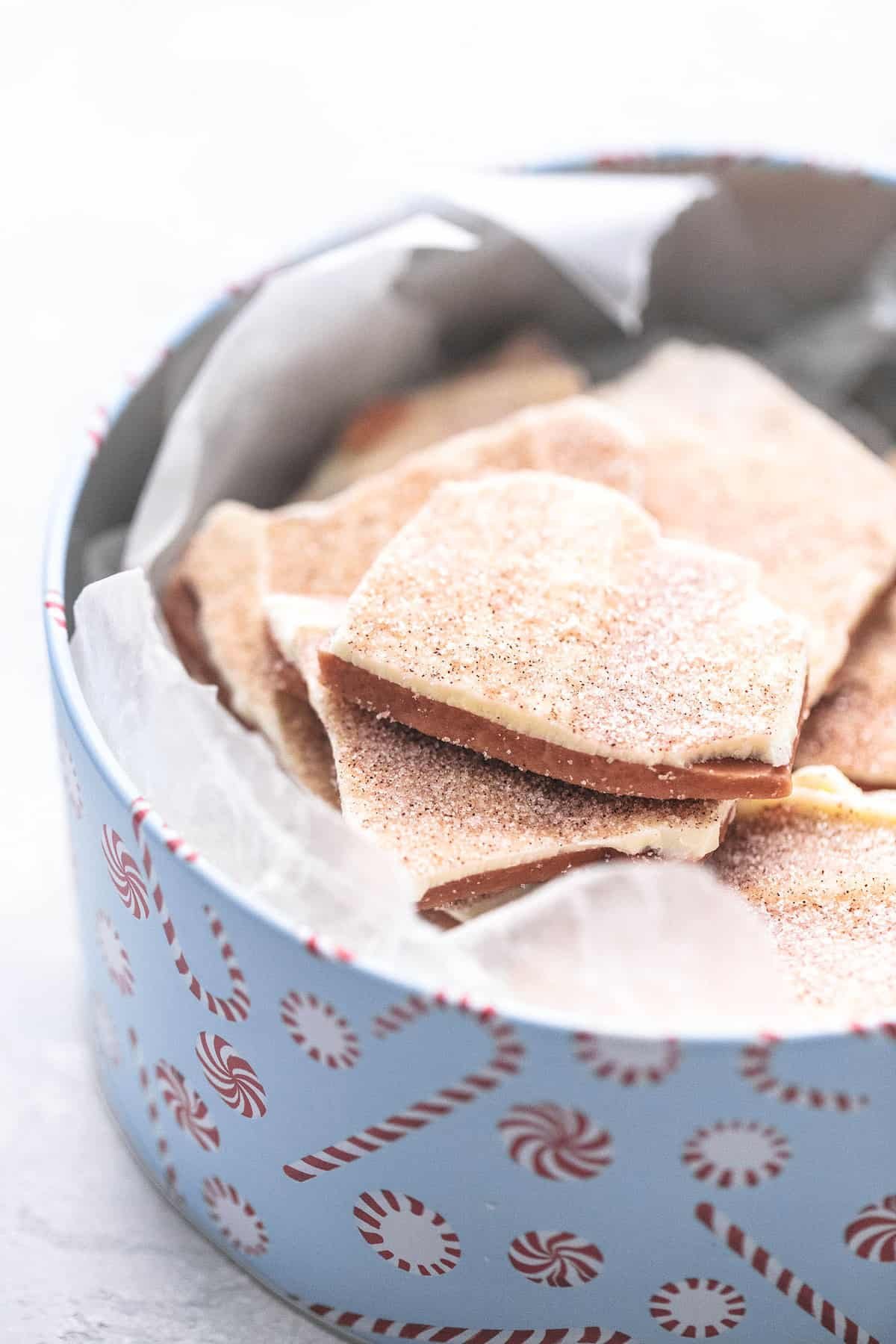 churro toffee (Disneyland copycat) in a tin can with peppermint candies on it.