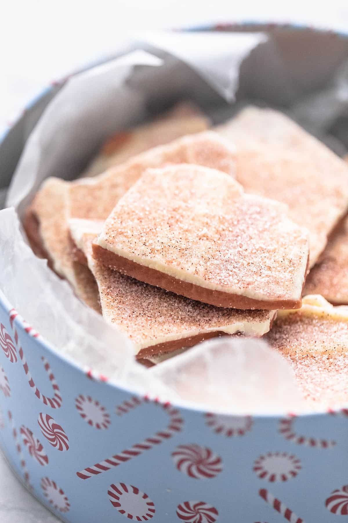 churro toffee (Disneyland copycat) in a tin can with peppermint candies on it.