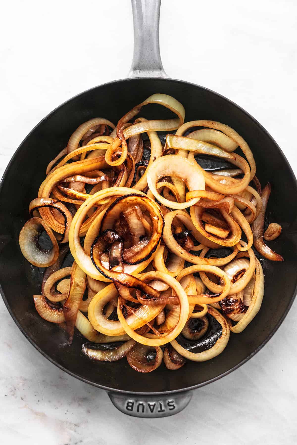 top view of sautéed onions in a skillet.