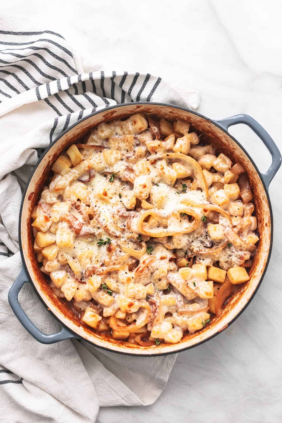 top view of French onion potatoes in a pan.