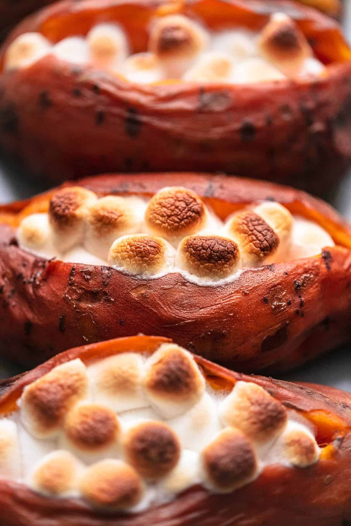 close up of instant pot baked sweet potatoes topped with marshmallows.