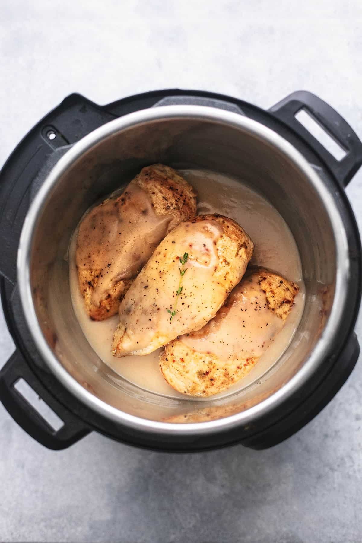 top view of instant pot chicken breast and gravy in an instant pot.