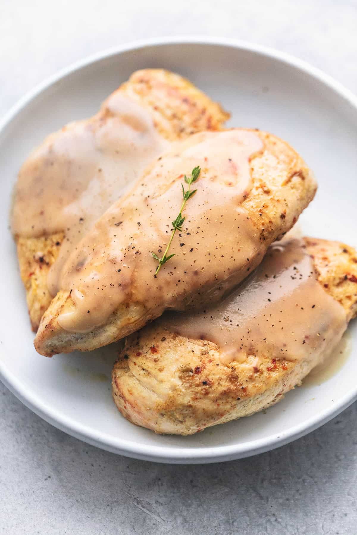 instant pot chicken breast and gravy on a plate.