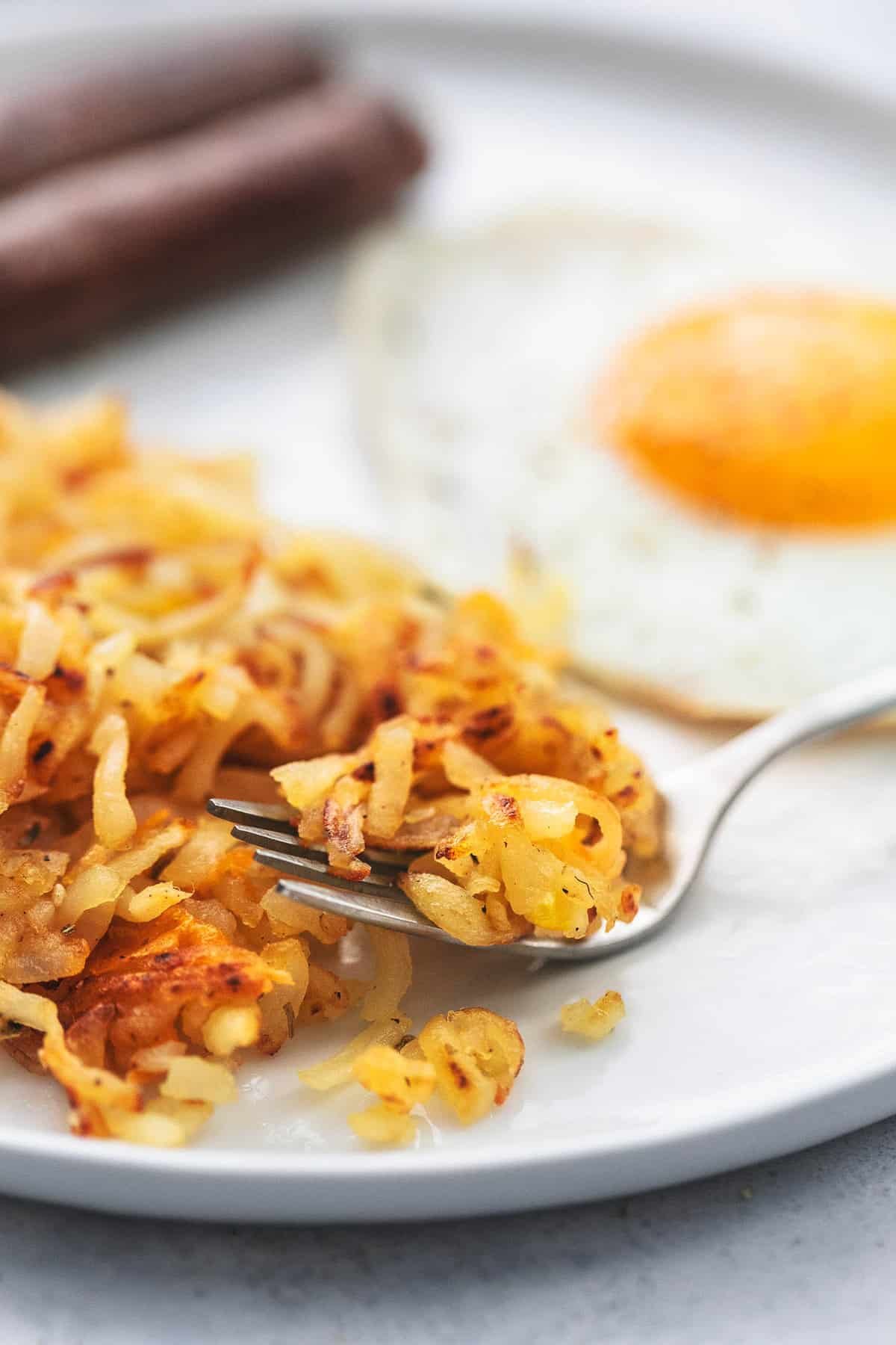 close up of sheet pan breakfast with a fork on a plate.