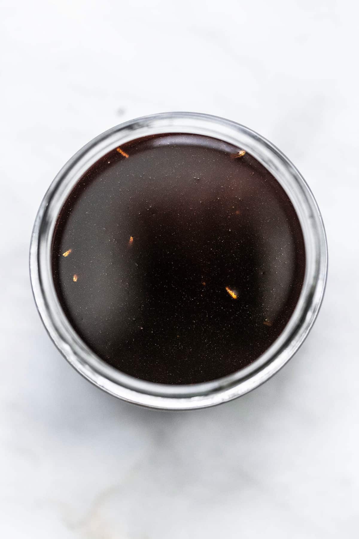 top view of balsamic vinaigrette salad dressing in a jar.