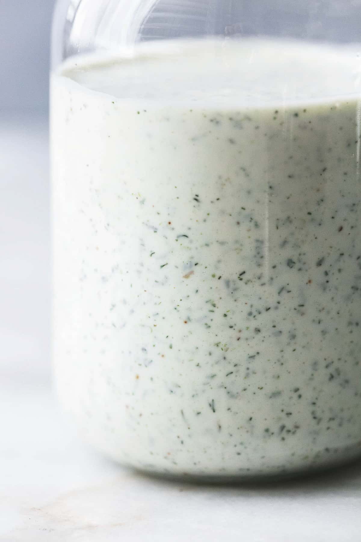 close up of Greek yogurt ranch dressing or dipping a jar.