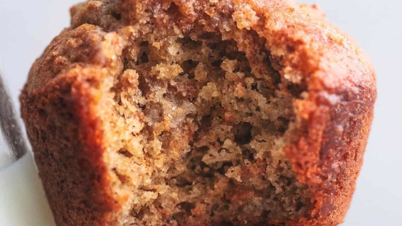 close up bran muffins with a bite out
