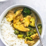 chicken and broccoli curry and rice in a bowl