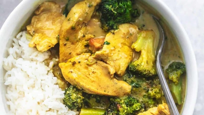 chicken and broccoli curry and rice in a bowl