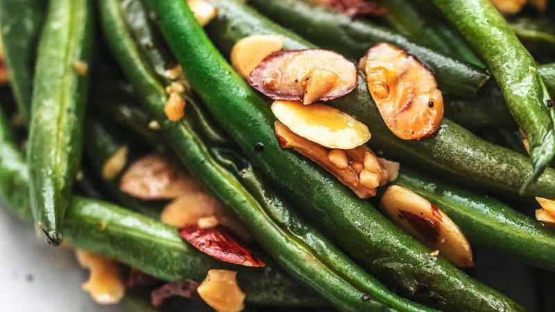 up close cooked green beans with almonds