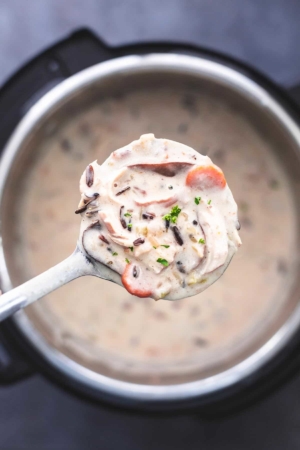 ladle of chicken wild rice soup over instant pot pressure cooker