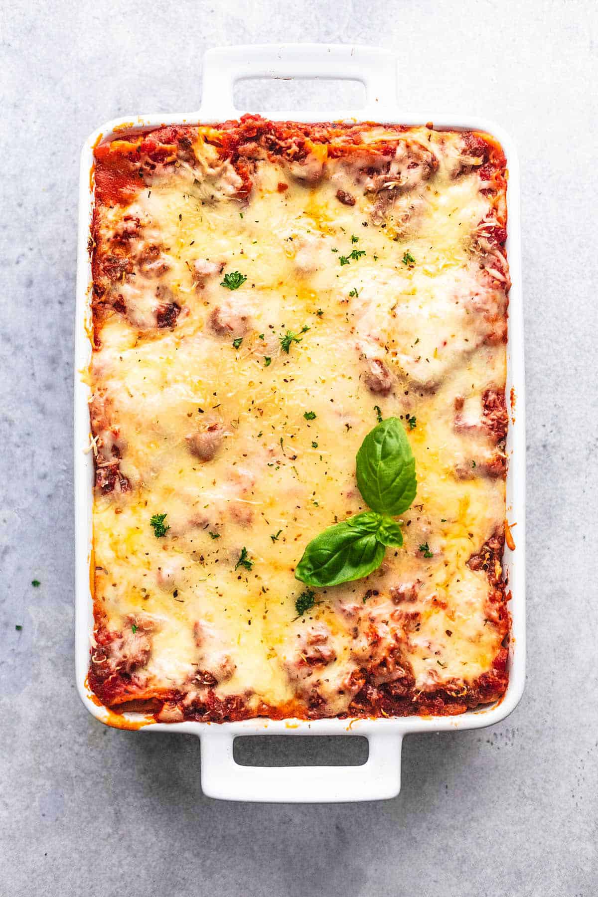 pan of lasagna on a gray background