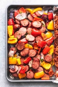 sausage and bell peppers and onions on a pan