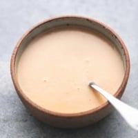 gravy with a spoon in a bowl