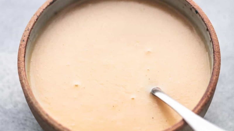 gravy with a spoon in a bowl