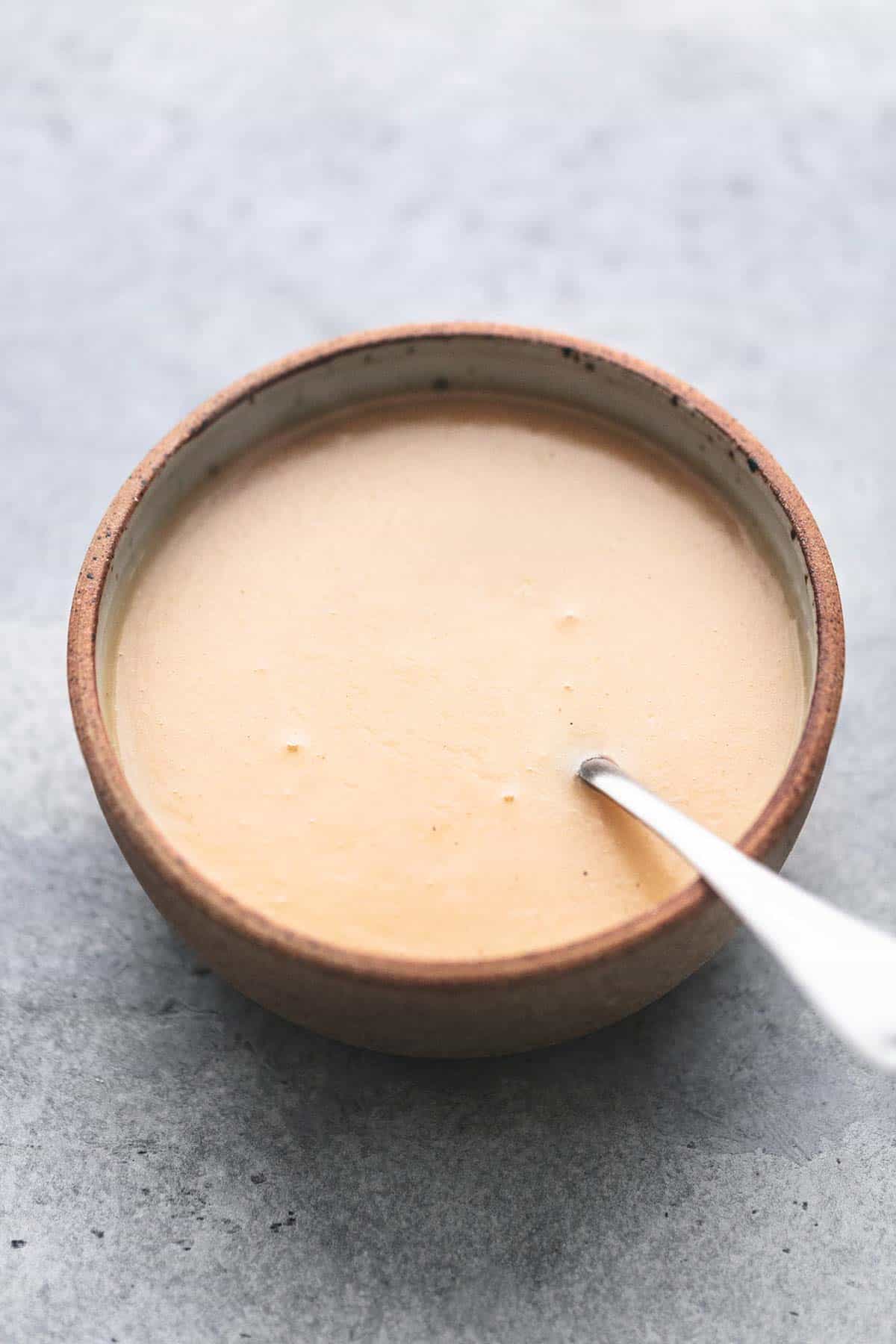 chicken gravy with a spoon in a bowl.