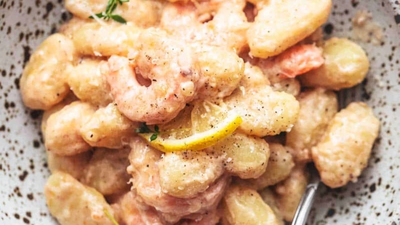 up close shrimp and gnocchi in a bowl