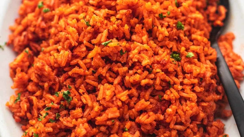 close up mexican spanish rice with a spoon