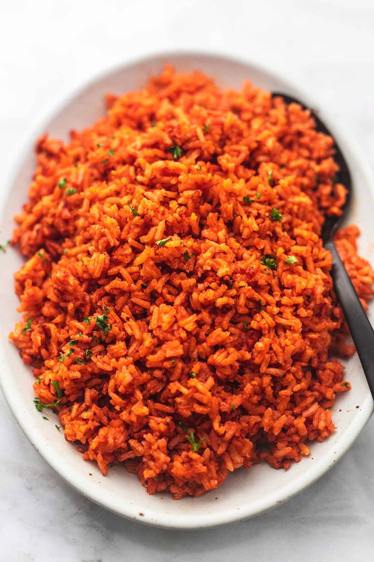 close up mexican spanish rice with a spoon