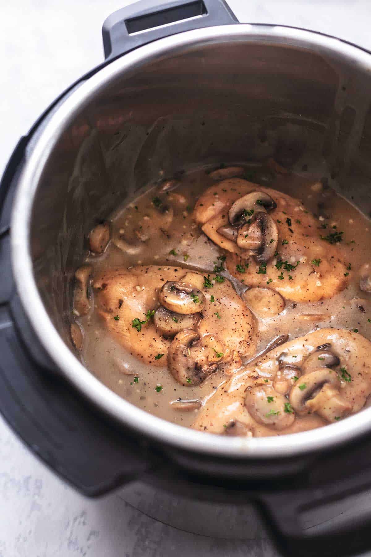 chicken with mushrooms and gravy in pressure cooker pot