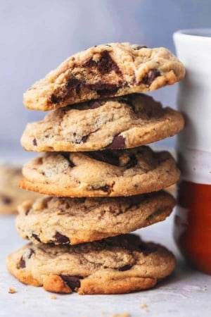 peanut butter cookies stacked against mug