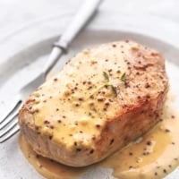 up close baked pork chops with honey mustard sauce