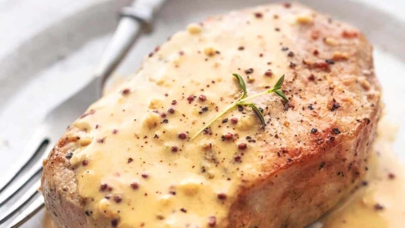 up close baked pork chops with honey mustard sauce