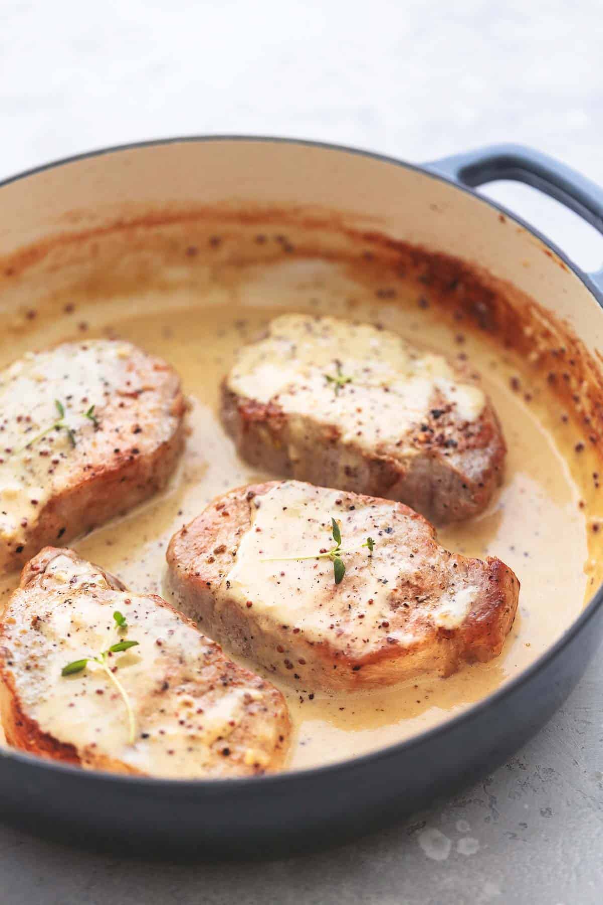 pork chops with dijon sauce in a pan