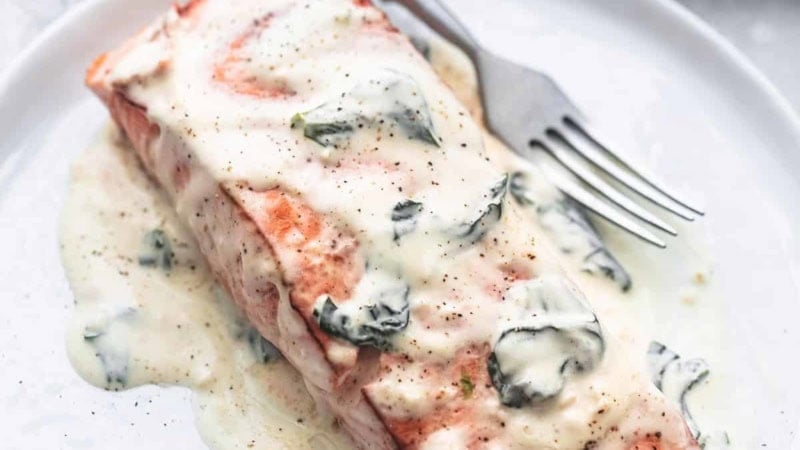 salmon florentine with a fork on a plate