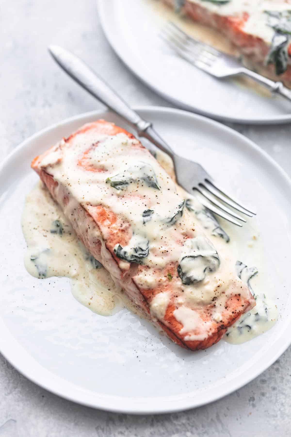 salmon florentine with a fork on a plate.