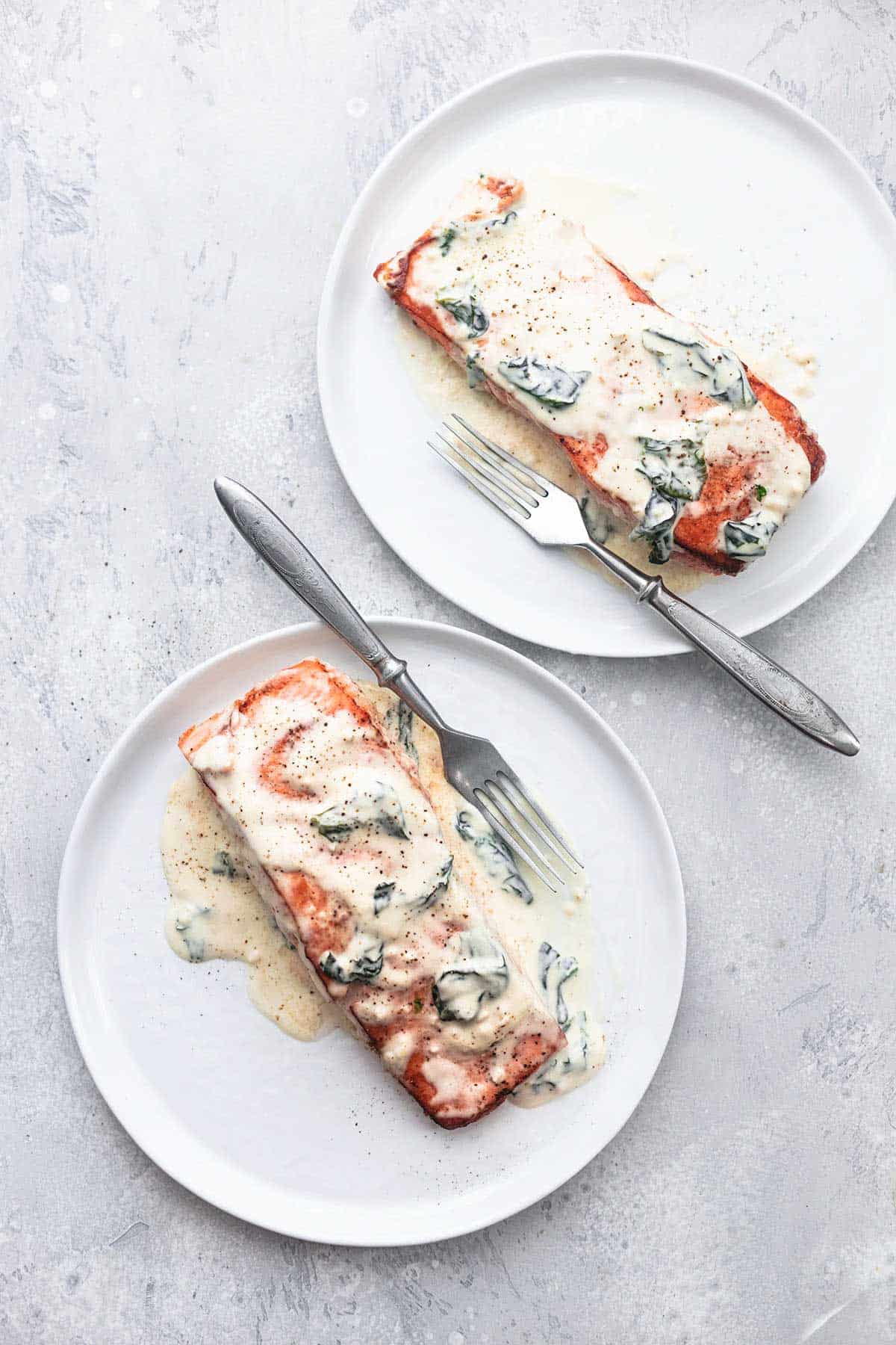 top view of salmon florentine on two plates with forks.