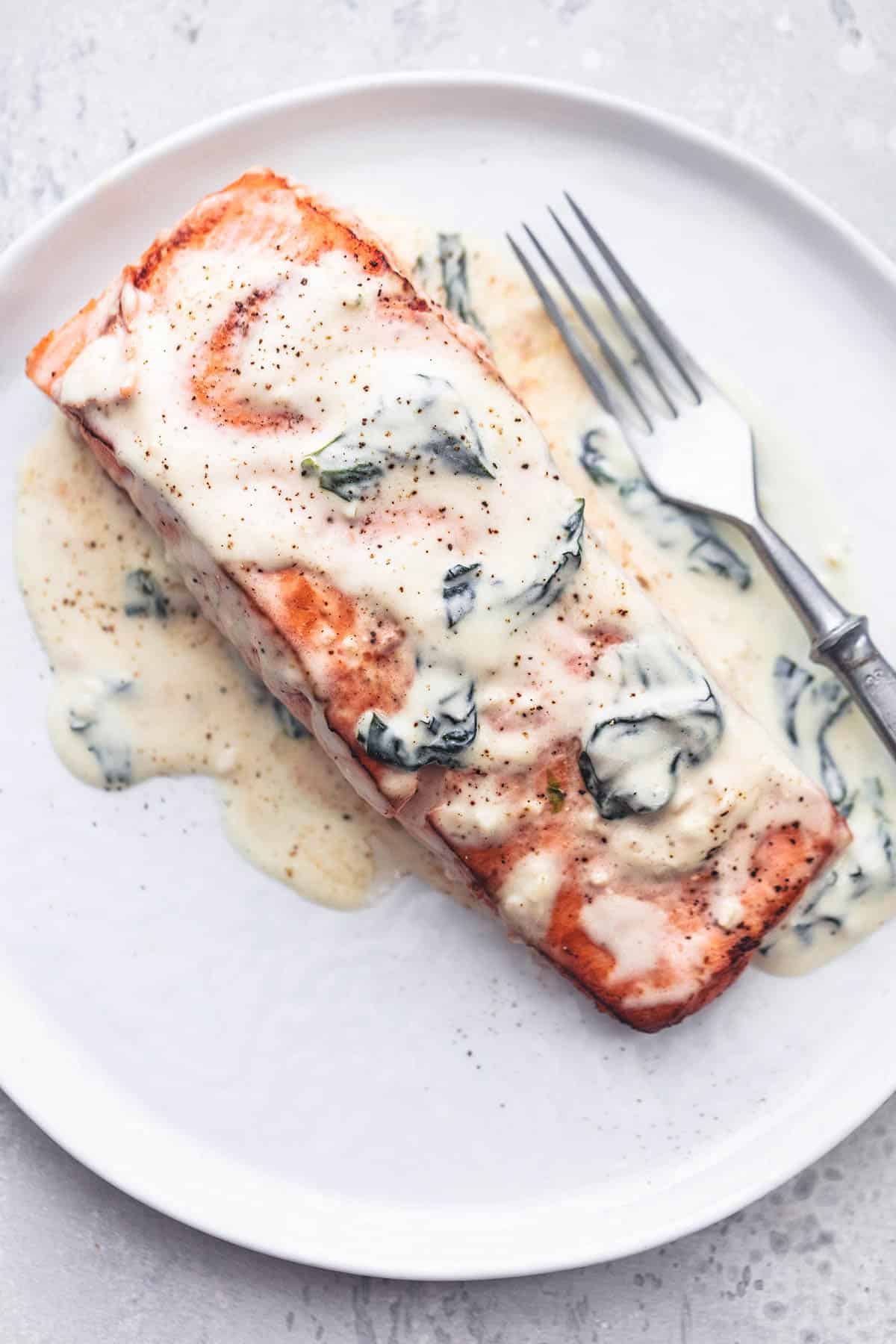 salmon florentine with a fork on a plate.