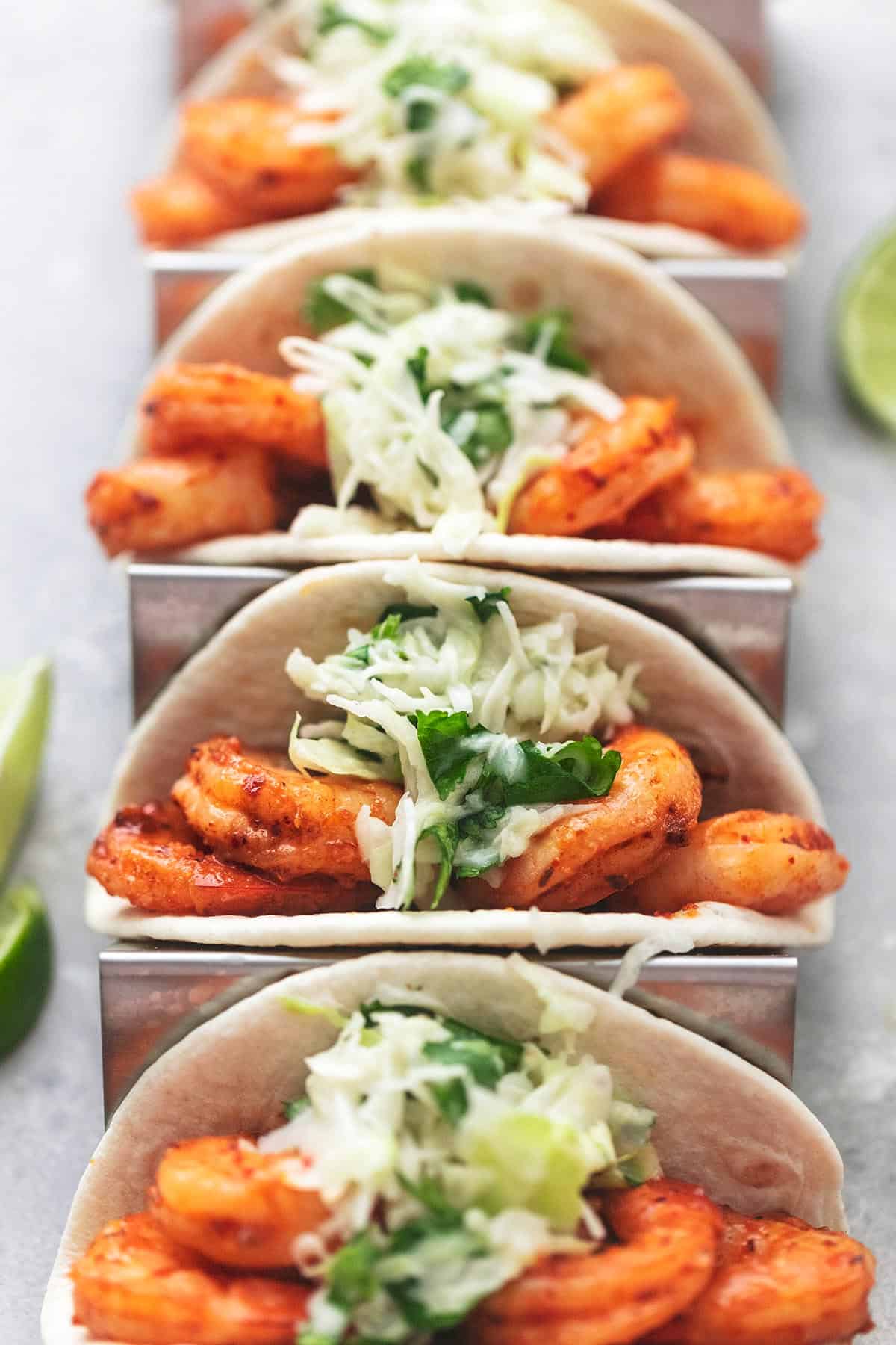 shrimp tacos with slaw in taco holders.