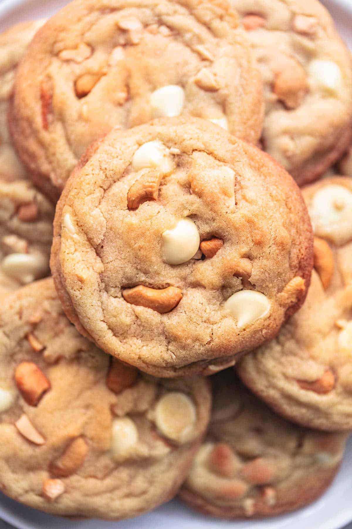 close up top view of chewy white chocolate cashew cookies.