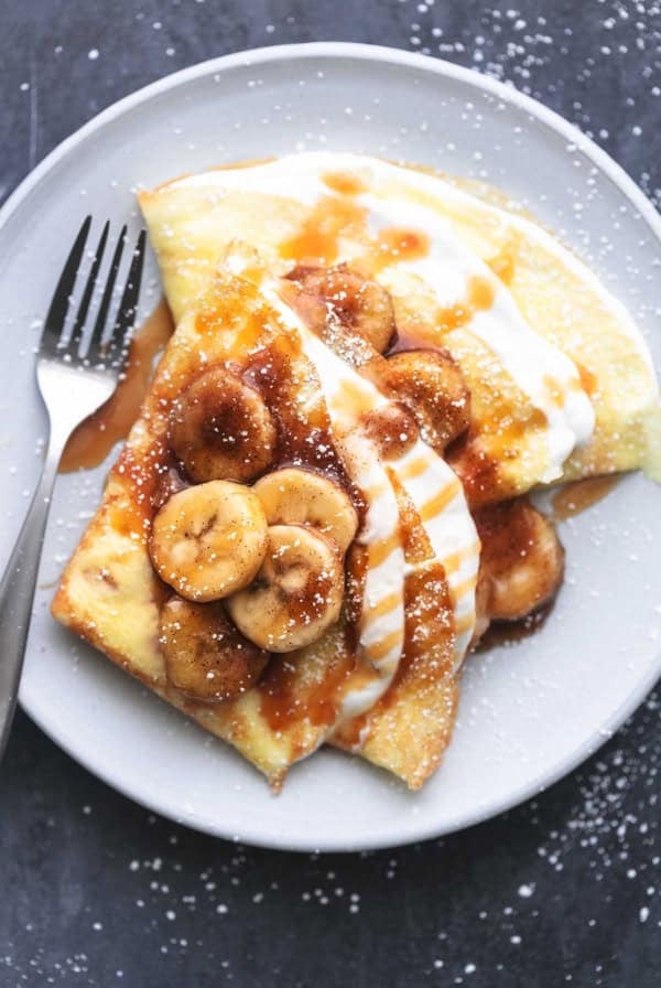 french dessert crepes on a plate with a fork