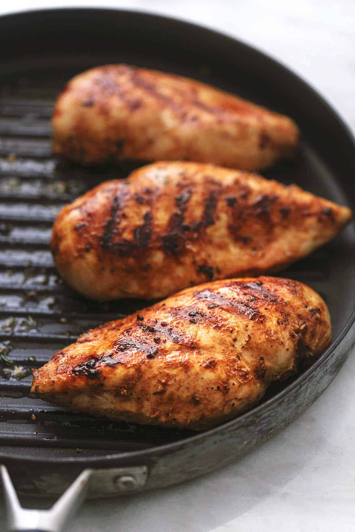 chicken breasts on a grill pan.
