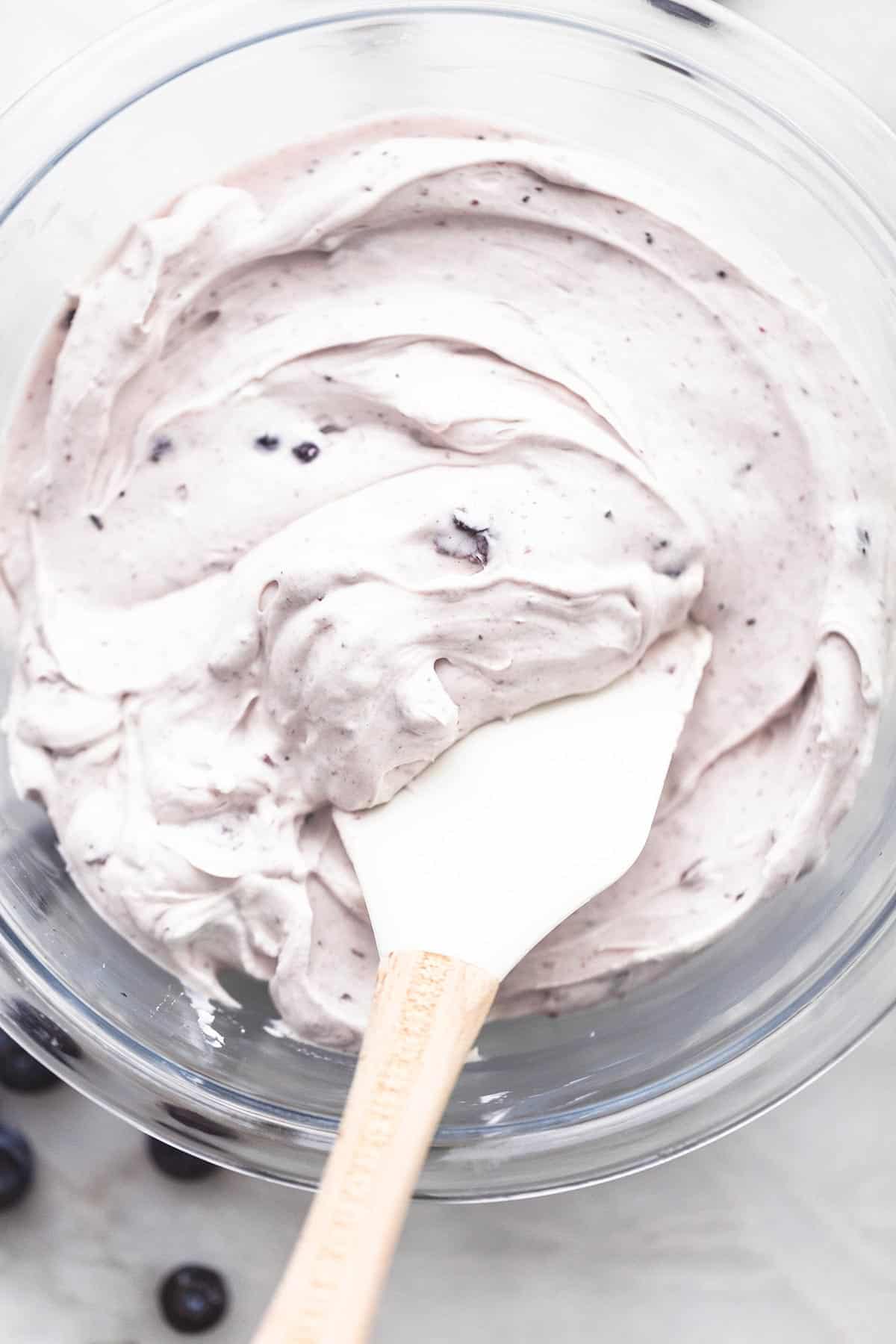 blueberry crepe filling overhead in bowl with spatula