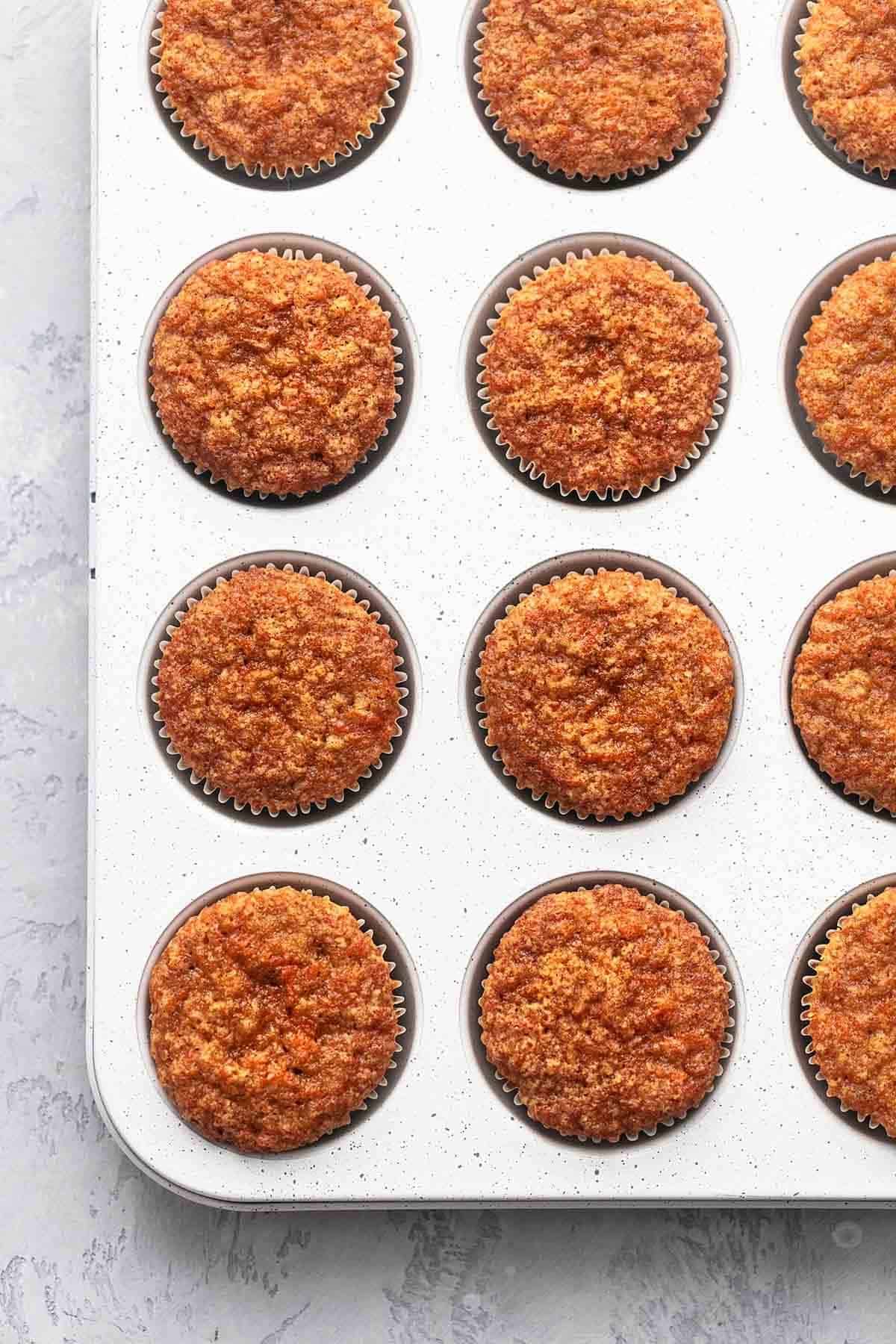 top view of carrot cake muffins in a muffin tin.