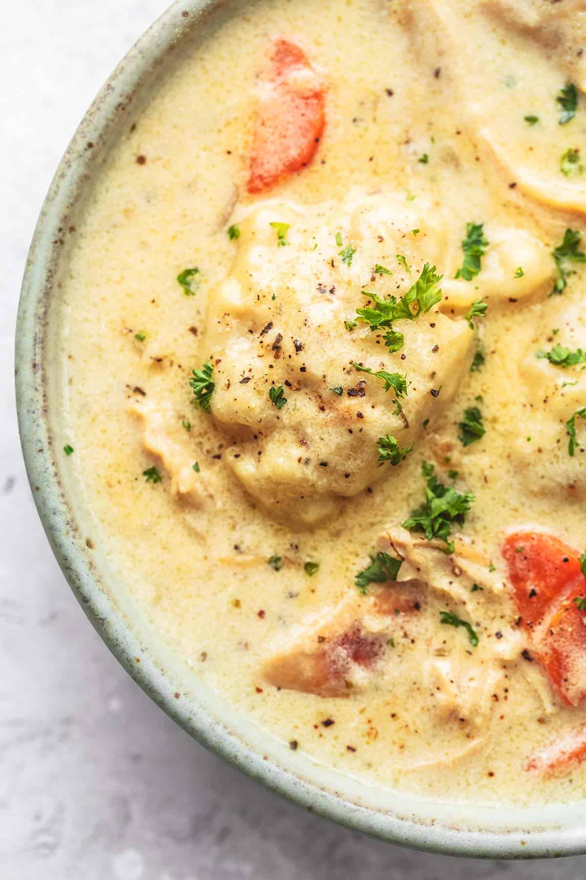 close up top view of instant pot chicken and dumplings in a bowl.