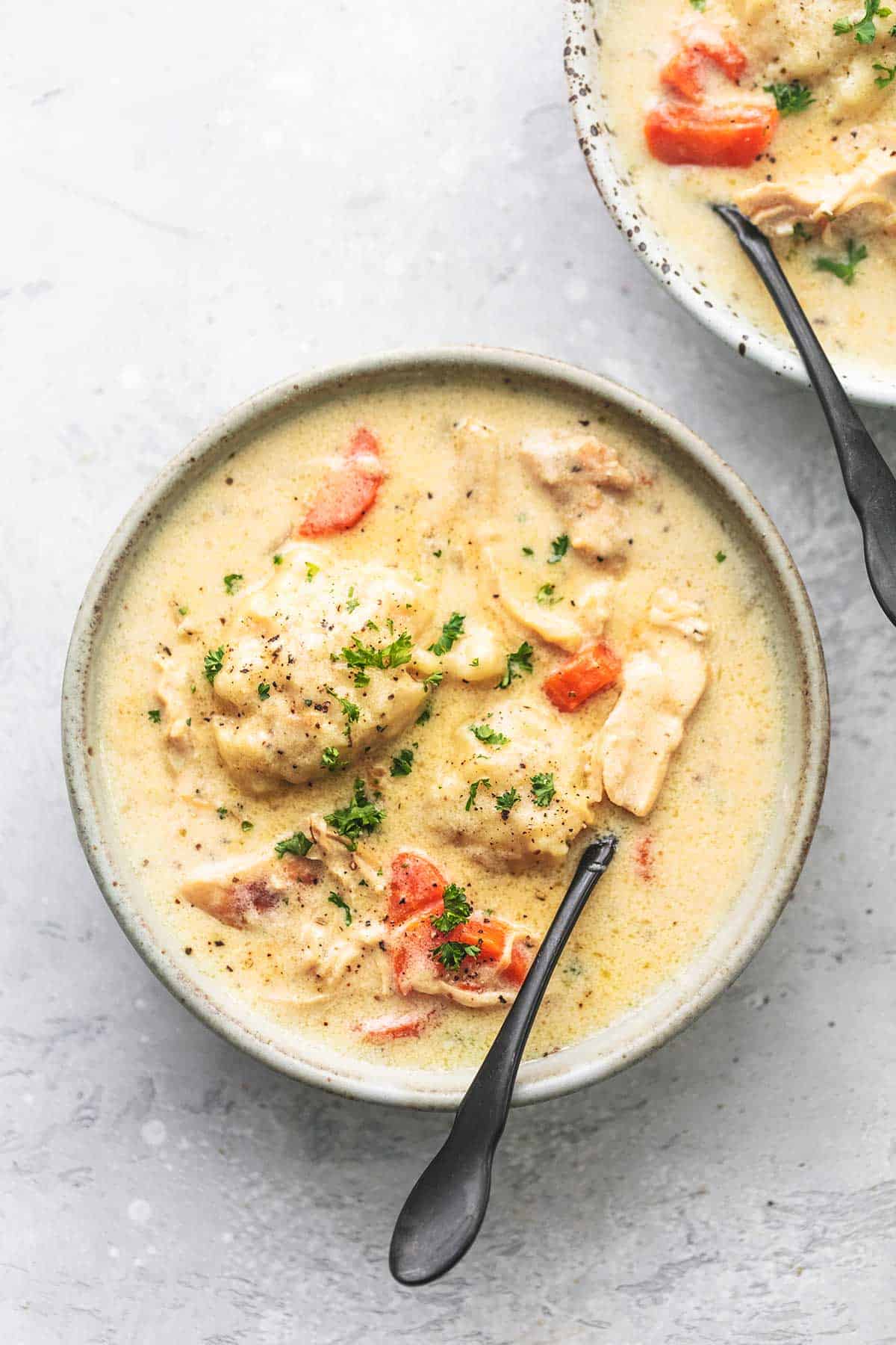 top view of instant pot chicken and dumplings with a fork in a bowl.