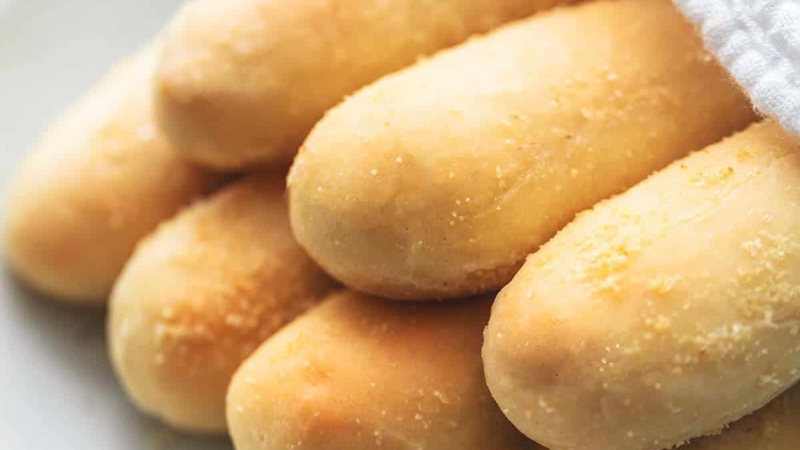 up close breadsticks with napkin on plate