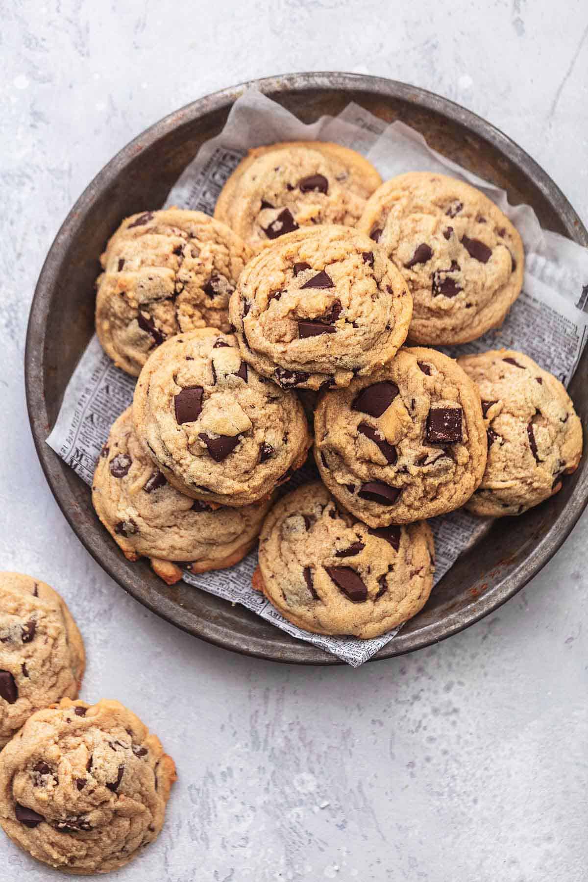 top view of peanut butter chocolate chunk cookies on a platter with more cookies on the side.