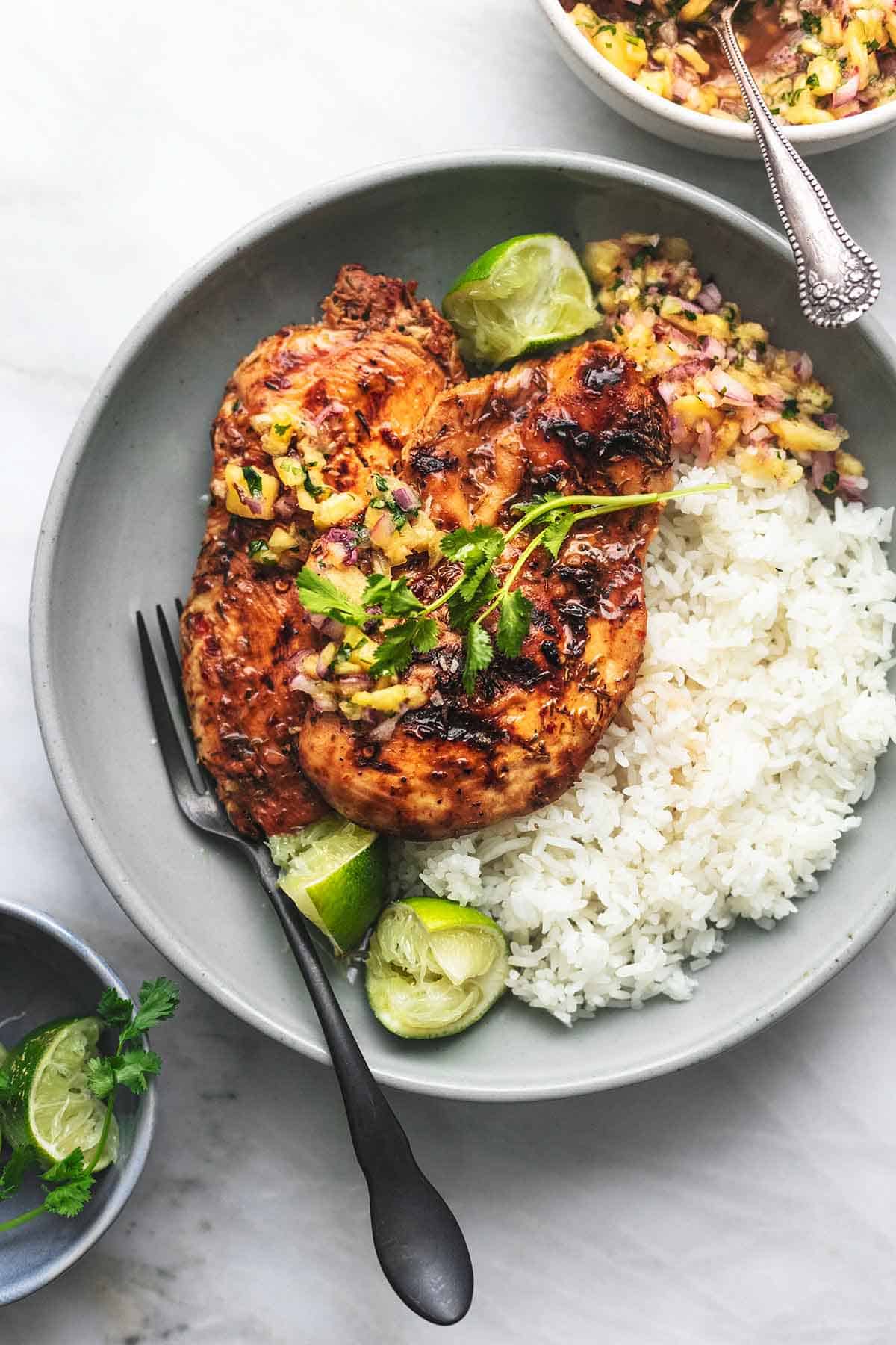 overhead chicken and pineapple salsa and white rice on gray plate