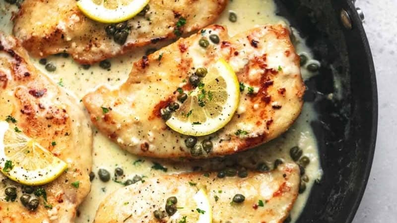 overhead lemon chicken piccata in skillet